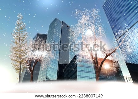Winter city ,trees covered by snow ,modern buildings ,light reflection in windows , snowfall ,business centre ,urban cityscape ,Tallinn 