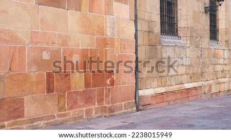 Orange stone in historic facade