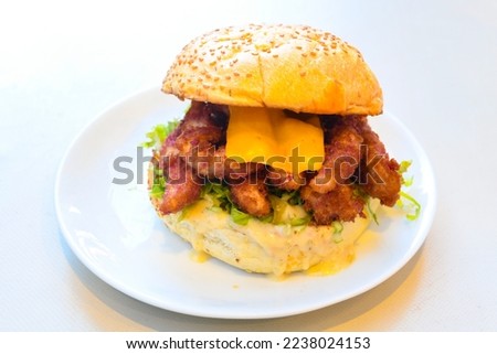 Big tasty burger with beef cutlet on a plate. Chicken Burger