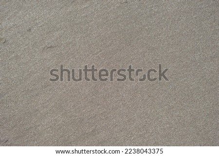 Surface of wet sand on the coast