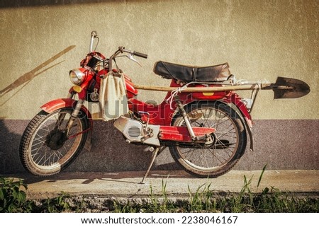 vintage motorbike with shovel and bag tomos former Yugoslavia Royalty-Free Stock Photo #2238046167