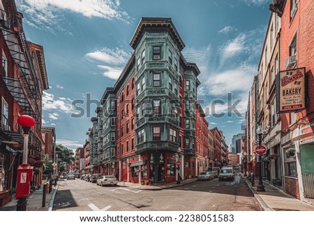Historic East End Boston Massachusetts United States brick buildings bakery restaurants and shops car street intersection landmark little Italy Italian American city town downtown area red orange USA Royalty-Free Stock Photo #2238051583