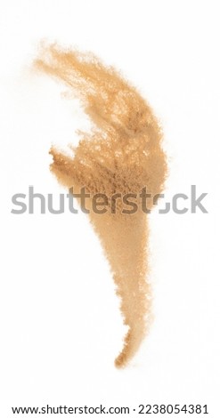 Small size fine Sand flying explosion, Golden grain wave explode. Abstract cloud fly. Yellow colored sand splash silica in Air. White background Isolated high speed shutter, throwing freeze shot