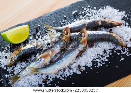 Picture of deliciously dish of anchovy baked in the oven on a pillow of sea salt