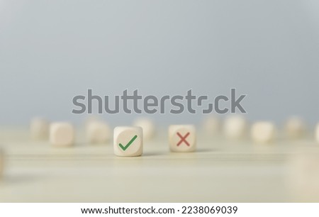 Wooden blocks show checks marks and are wrong. concepts decisions, votes, and thinking yes or no. Business options for difficult situations true and false symbols Royalty-Free Stock Photo #2238069039