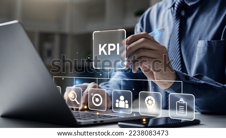Hand touching KPI Performance Indicator for Business on laptop screen, KPI technology system concept