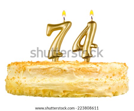 birthday cake with candles number seventy four isolated on white background