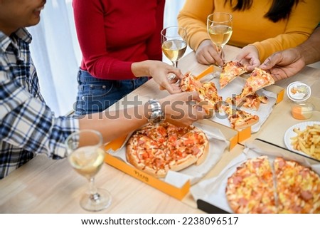 close-up image, A group of friends eating pizza in the party together. New year party, Birthday party, Pizza party at home.