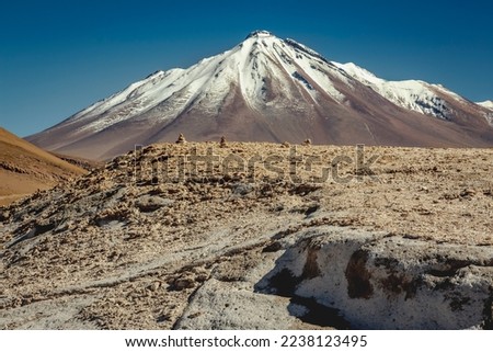 Atacama desert, snowcapped volcano and arid landscape in Northern Chile