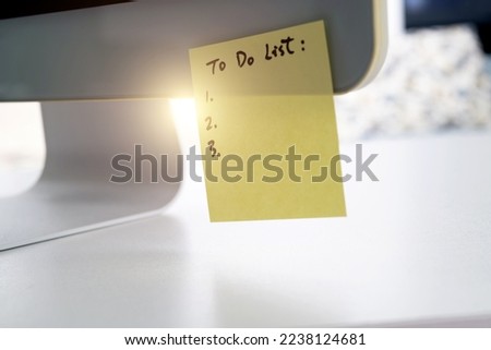 Sticky note on computer monitor Royalty-Free Stock Photo #2238124681