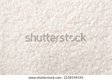 white plush fleece fabric texture background , background pattern of soft warm material Royalty-Free Stock Photo #2238144545