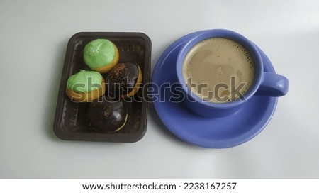 Picture of a cup of coffee and cake for dessert. Perfect for your blog banner and offline or online shop, or culinary news.