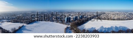 High angle view of Snow covered North Luton's landscape and Cityscape, Aerial Footage of Luton City of England UK after Snow Fall. The 1st Snow Fall of this Winter of 2022