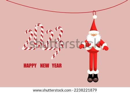 Background Happy New Year.Santa Claus in the form of a toy.The numbers 2023 are made of candy cane.Christmas and New Year web banner.