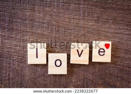 comment day of love. letters love on wooden floor