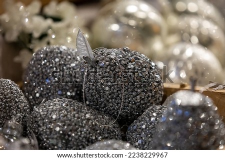 A close up of decorative Christmas baubles, with a shallow depth of field