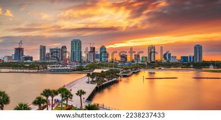 St. Pete, Florida, USA downtown city skyline on the bay at dusk.