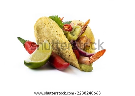 Mexican tacos with shrimp,guacamole and vegetables isolated on white background