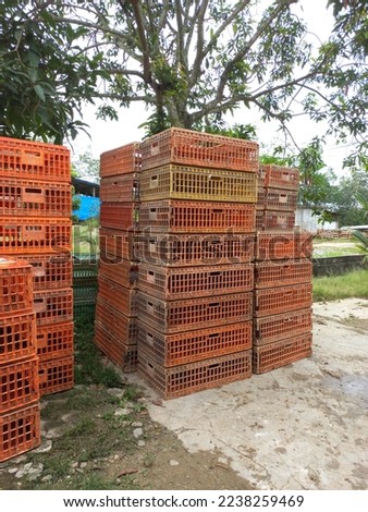 The chicken cage is empty stacked high. Animals do not have space and squeeze into small areas.selective focus