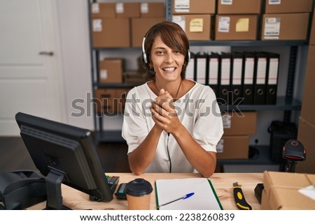 Young beautiful hispanic woman ecommerce business agent having video call at office