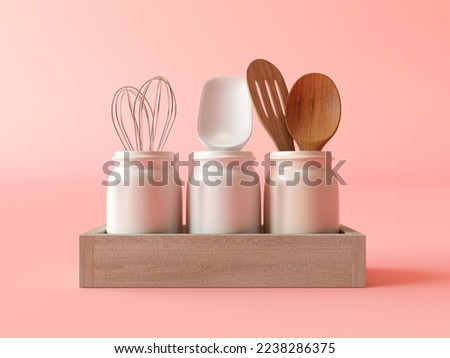 Kitchen utensils. A set of three ceramic kitchen containers with cutlery. Corolla, wooden spatula, delicate pink background. Kitchen composition of three cans isolated on peach background. Flat lay