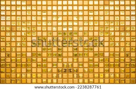 Luxury gold mosaic tiles background texture as background. Golden shiny ceramic tile wall pattern. High resolution photo.
