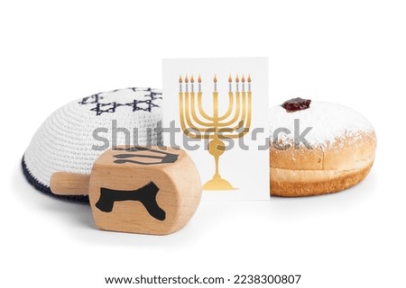 Greeting card with menorah, kipa, dreidel and doughnut for Hannukah celebration on white background