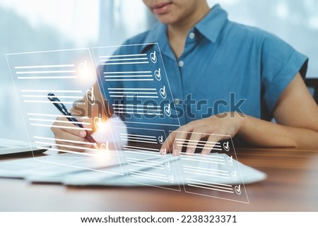 Women Electronic Signature Concept, Electronic Signing Businessman signs electronic documents on digital documents on virtual laptop screen using stylus pen.