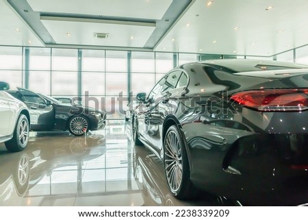 new car in the car dealership showroom Royalty-Free Stock Photo #2238339209