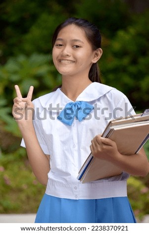 Fun Young Asian School Girl With School Books