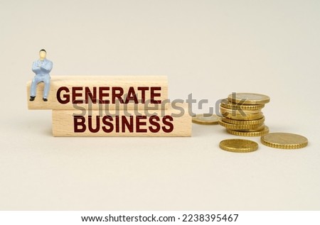 Business concept. On the table are coins, wooden plates with the inscription - Generate Business. A figure of a businessman sits on the dice.