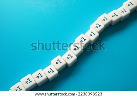 Plus one. Sequential addition to the sum. Rows of blocks. Add one more. Sequence. Arithmetic progression. Increase and growth. A series concept. Accumulation process. Royalty-Free Stock Photo #2238398523