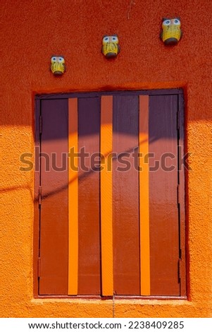 detail of wooden window with strong colors forming contrasting and abstract graphics. Space for text. Sao Luiz do Paraitinga, Sao Paulo state, Brazil.