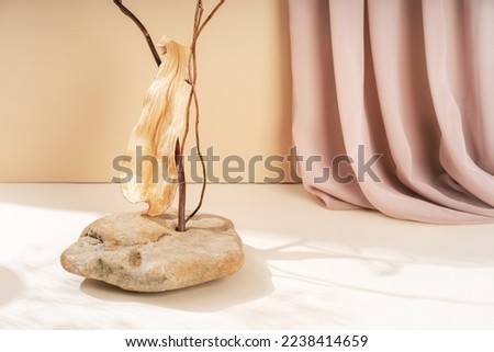 Composition empty podium material tree stone dry flowers. Beautiful beige background made of natural materials for product presentation
