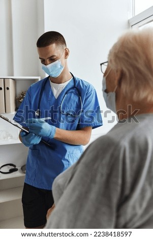 elderly woman with a doctor examination hospital office