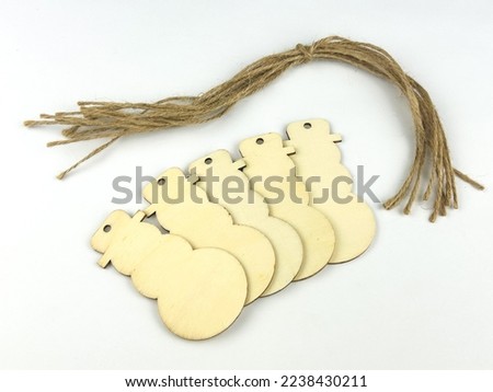 Wooden snowman ornaments on a white background isolated