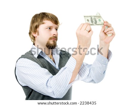 Young man checking dollar bills