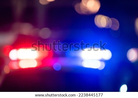 Police car with flashing lights at night
 Royalty-Free Stock Photo #2238445177