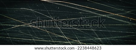Scratched film texture. Many bright lines in different directions. Panoramic background for grunge and vintage design.