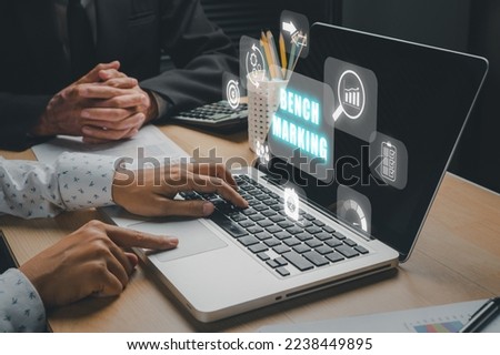 Business concept of benchmark, Business person team working on laptop computer with benchmarking icon on virtual screen, Business, Technology, Internet and network. Royalty-Free Stock Photo #2238449895