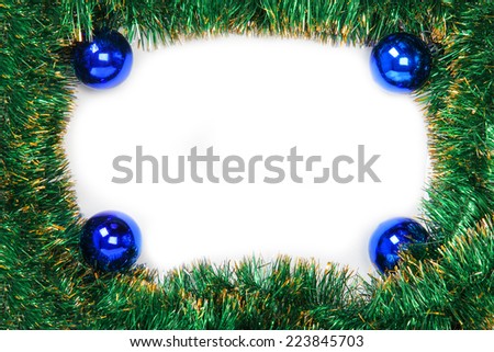 Frame of green Christmas garland with blue balls on a white background