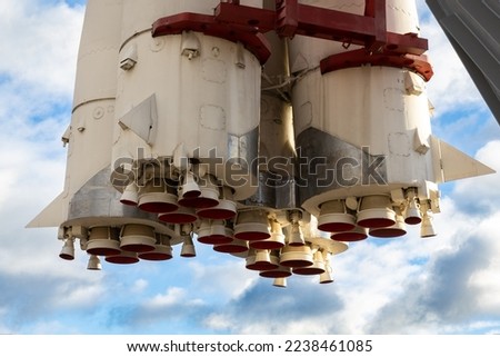 Nozzles of Vostok space booster rocket model against cloudy blue sky at VDNKh, Moscow. First Russian spaceship Vostok. Royalty-Free Stock Photo #2238461085