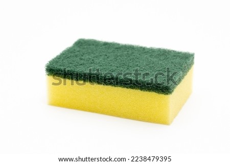 Cleaning concept, Yellow sponge for dishwashing in kitchen isolated on white background. Royalty-Free Stock Photo #2238479395