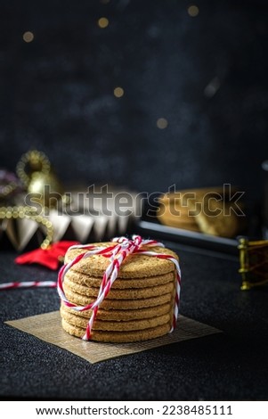 a stack of cookies tied with a Christmas ribbon. High quality photo