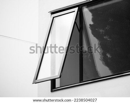 Awning window with modern metal frame