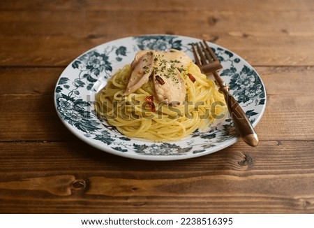 Pasta with chicken breast, chili and garlic