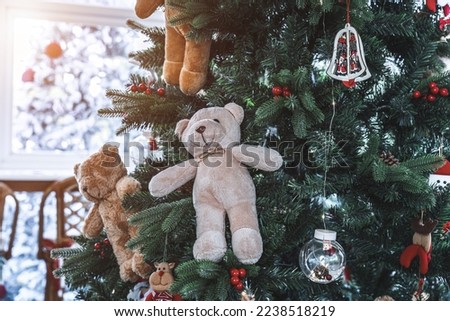 Merry x-mas,Close up of Colorful balls ,gifts box and Christmas greeting picture parcel,Teddy Bear decoration on Green Christmas tree background Decoration During Christmas and New Year.