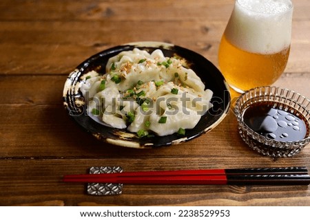 Dumplings served with vinegar and soy sauce