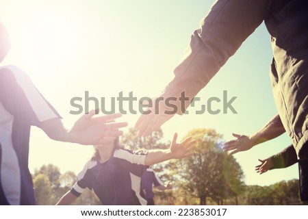 High Five line after a child's soccer game.  Instagram effect Royalty-Free Stock Photo #223853017