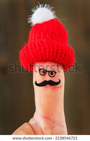 funny finger character in hat